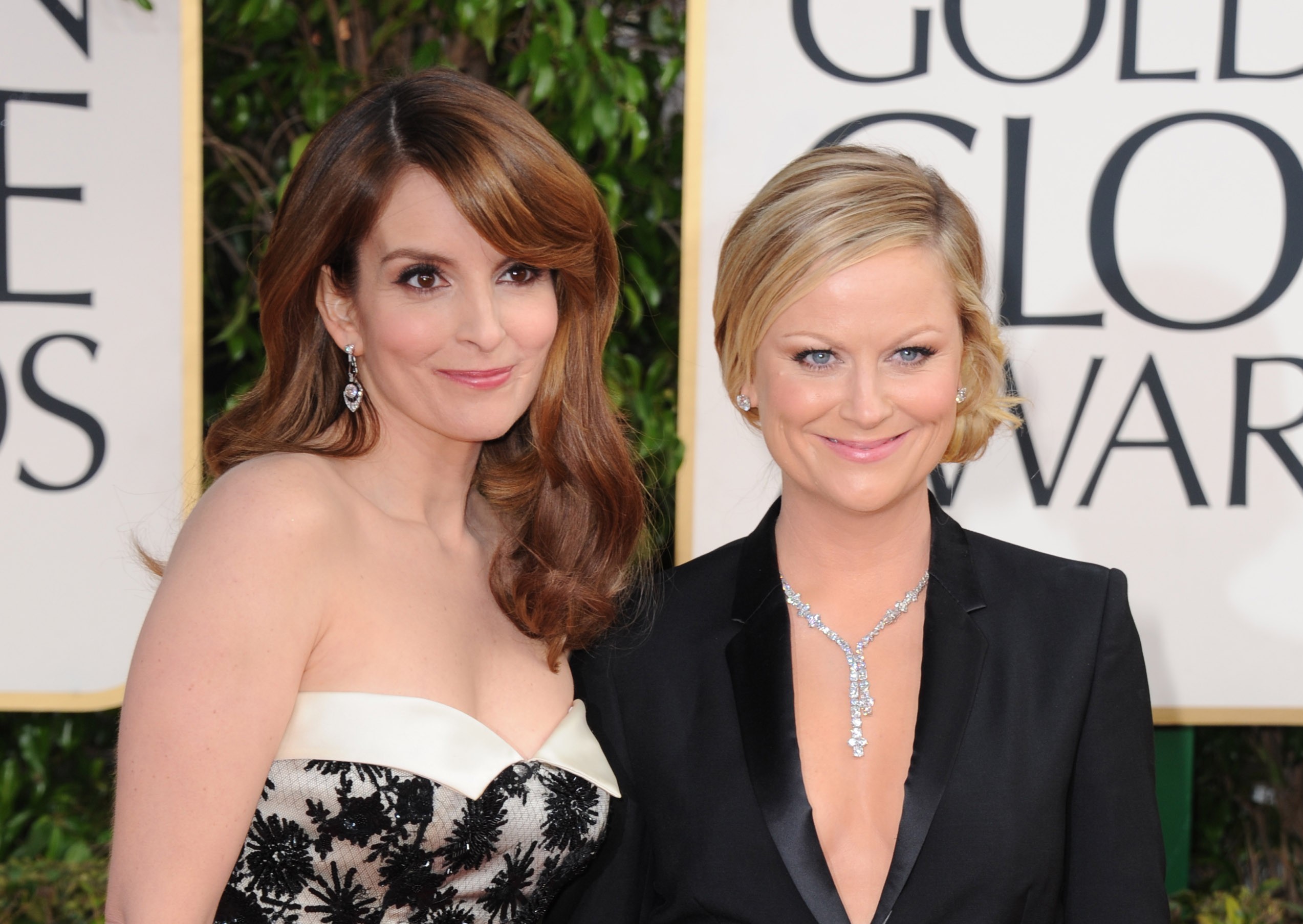 Show hosts Tina Fey, left, and Amy Poehler arrive at the 70th Annual Golden Globe Awards at the Beverly Hilton Hotel on Sunday Jan. 13, 2013, in Beverly Hills, Calif. (Photo by Jordan Strauss/Invision/AP) (Jordan Strauss/invision/ap)
