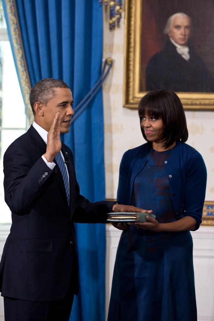 With Michelle Obama holding the bible, President Obama takes the oath of office Jan. 20, 2013 (Pete Souza/White House)