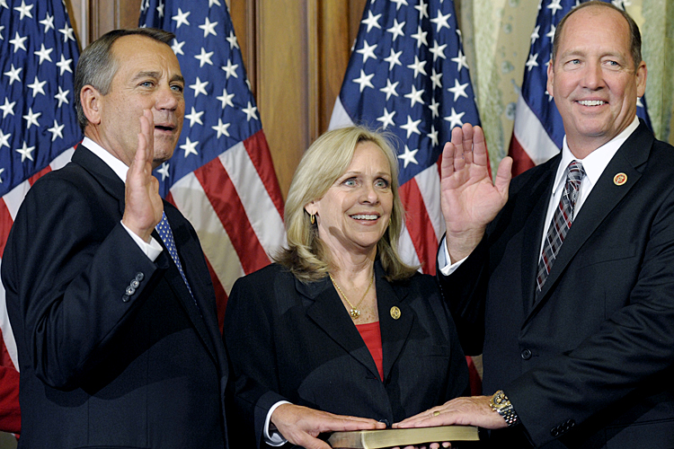 John Boehner performs a mock swearing in for Rep. Ted Yoho, R-Fla., Thursday, Jan. 3, 2013, on Capitol Hill. (AP/Cliff Owen)