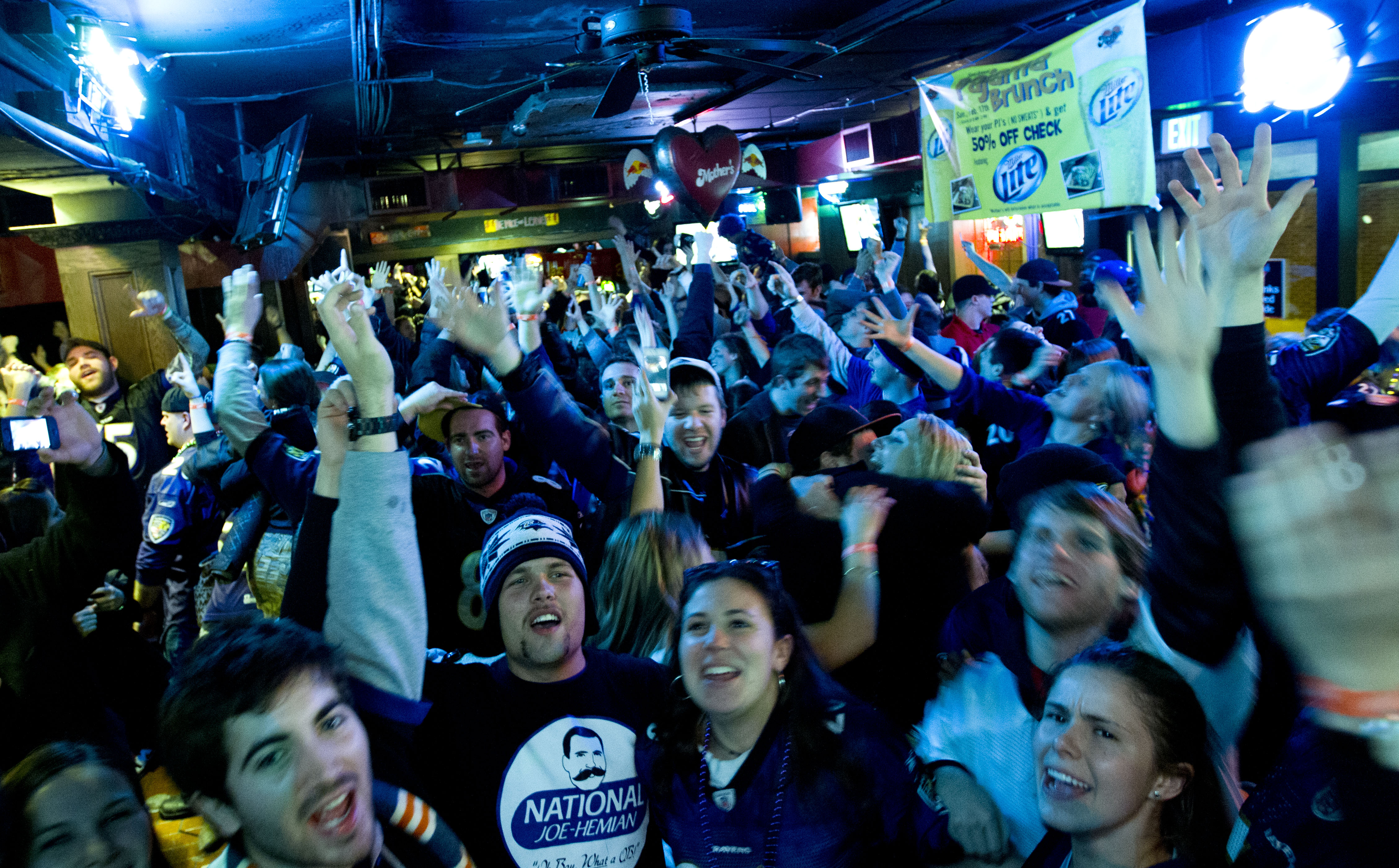 Baltimore Ravens fans celebrate at a pub in Baltimore after the Ravens won the NFL football Super Bowl against the San Francisco 49ers, Sunday, Feb. 3, 2013. (AP/Jose Luis Magana)