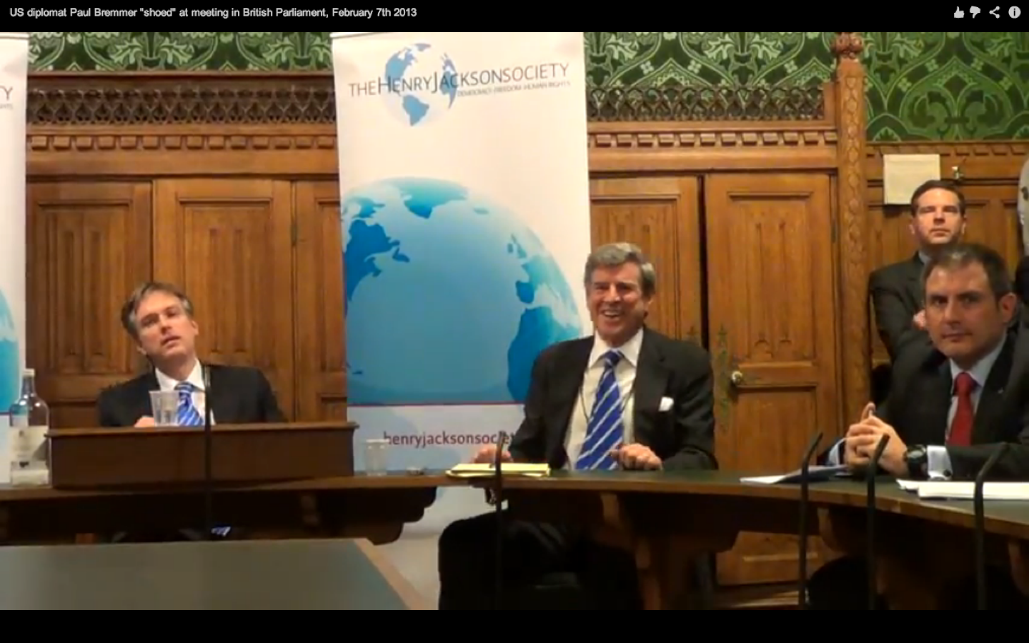 Paul Bremer reacts after a shoe is thrown at him at an event organized by the neoconservative Henry Jackson Society in London.