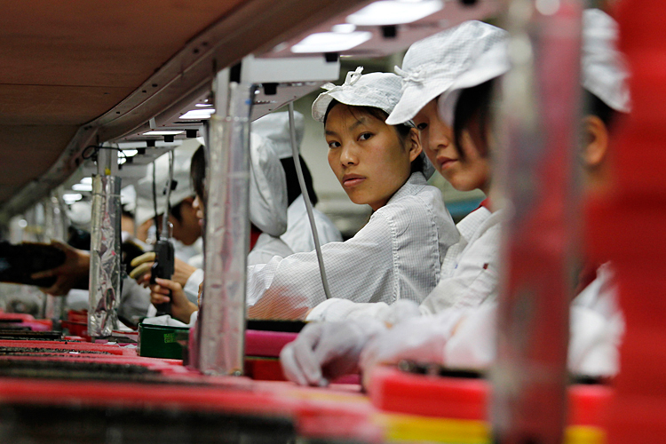 Workers are seen inside a Foxconn factory in the township of Longhua in the southern Guangdong province. (Reuters/Bobby Yip)