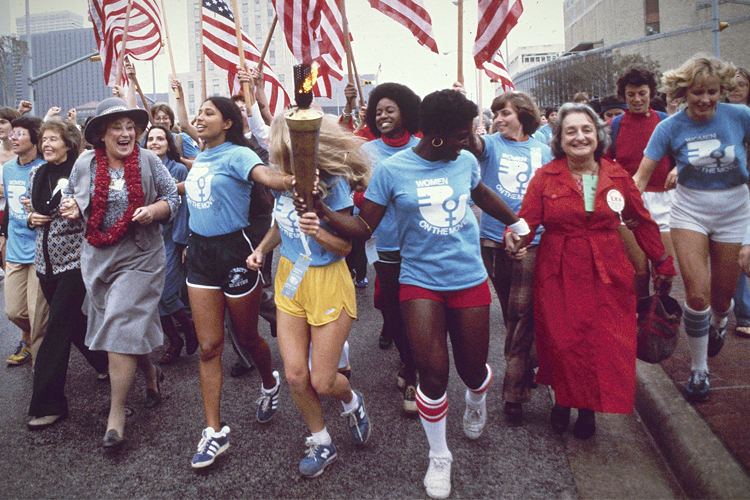 From PBS's "Makers": Some leaders of the women's movement pass a torch that was carried by foot from New York to Houston, Tex., for the November 1977 National Women's Convention. (PBS/AP/Greg Smith)