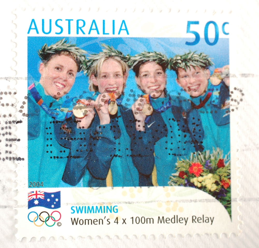 A stamp from Australia shows image of the gold medal winning women's 4x100m medley relay team from the Athens Olympics, circa 2004 (<a href="http://www.shutterstock.com/gallery-166210p1.html?cr=00&pl=edit-00">Brendan Howard</a> / <a href="http://www.shutterstock.com/?cr=00&pl=edit-00">Shutterstock.com</a>)