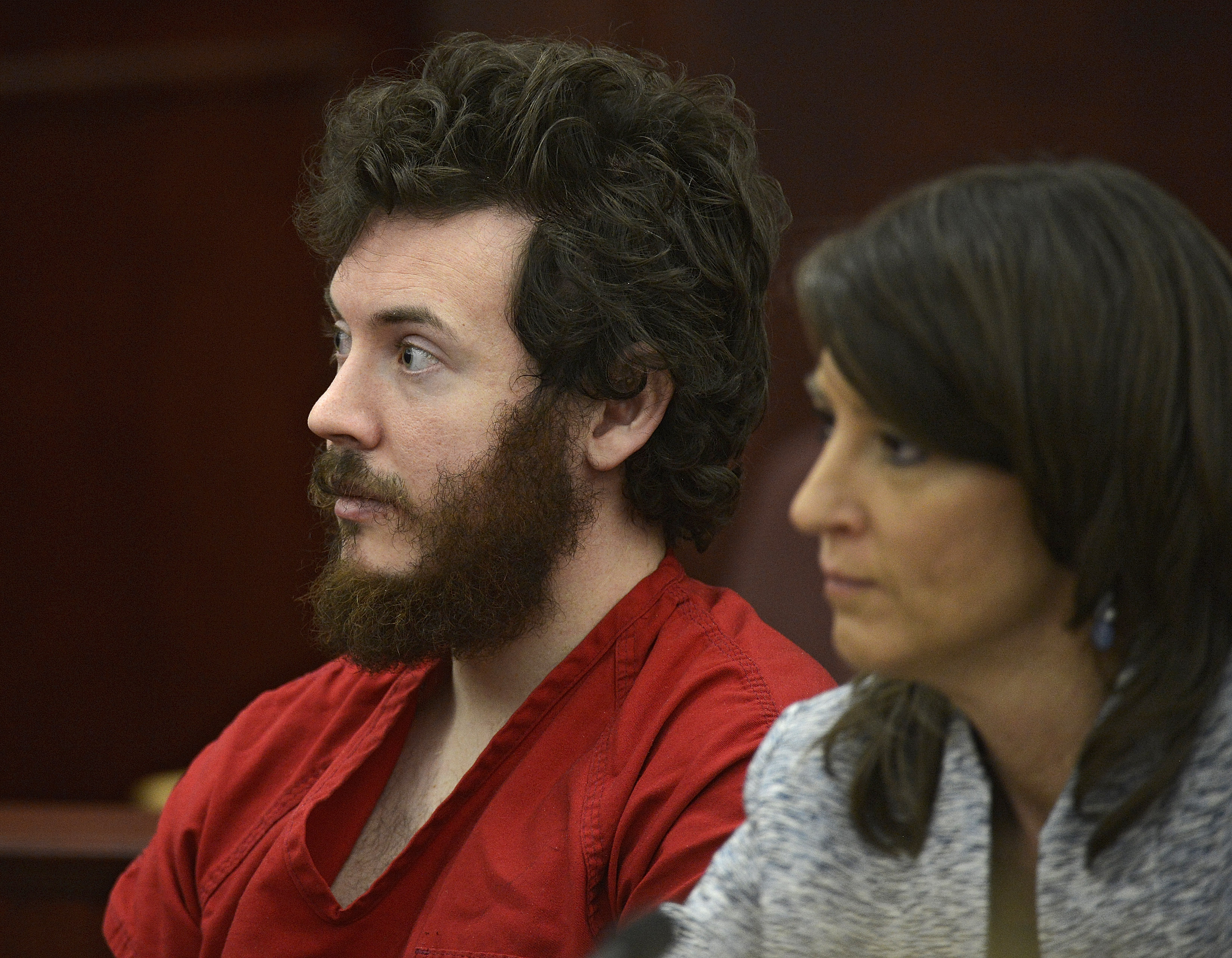 James Holmes, left, and defense attorney Tamara Brady appear in district court in Centennial, Colo. for his arraignment. (AP/The Denver Post, RJ Sangosti)