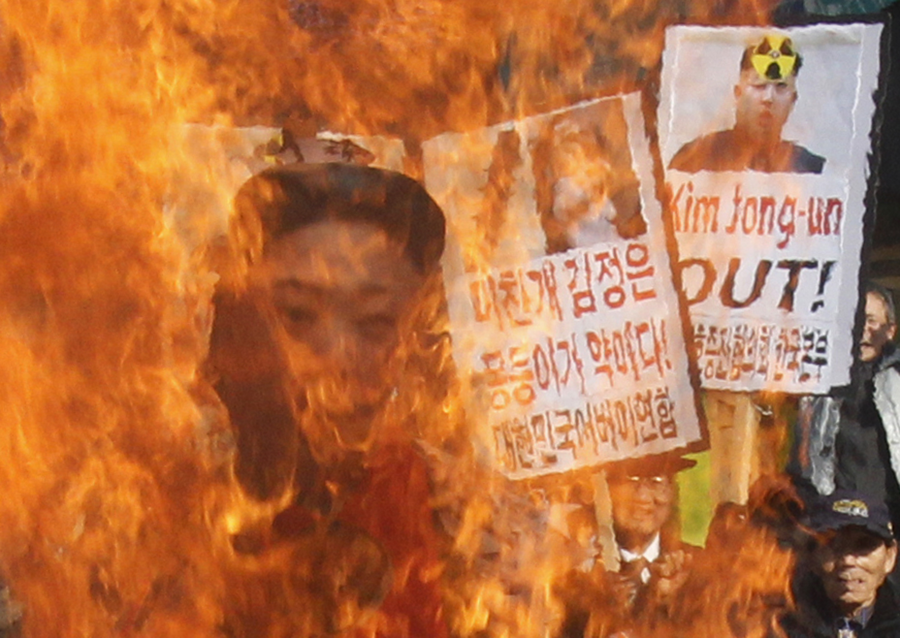 South Korean protesters burn an effigy of North Korean leader Kim Jong Un during an anti-North Korea rally to denounce North Korea's nuclear test  in Seoul, South Korea. (AP/Ahn Young-joon)