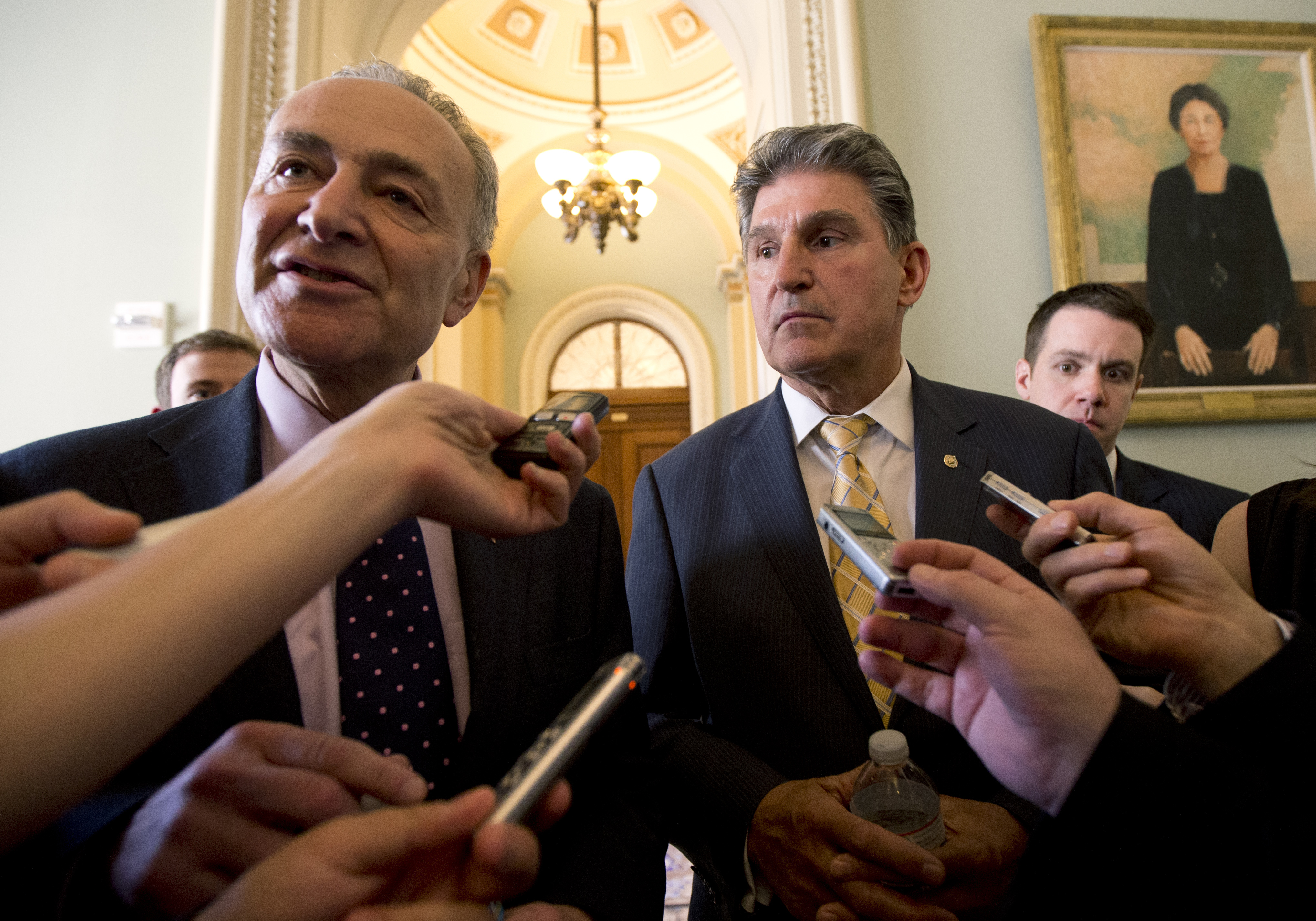 Sens. Chuck Schumer, D-N.Y., left, and Joe Manchin, D-W.Va. speak to reporters as they walk from Senate Majority Leader Harry Reid's, D-Nev., office on Capitol Hill in Washington. (AP/Manuel Balce Ceneta)