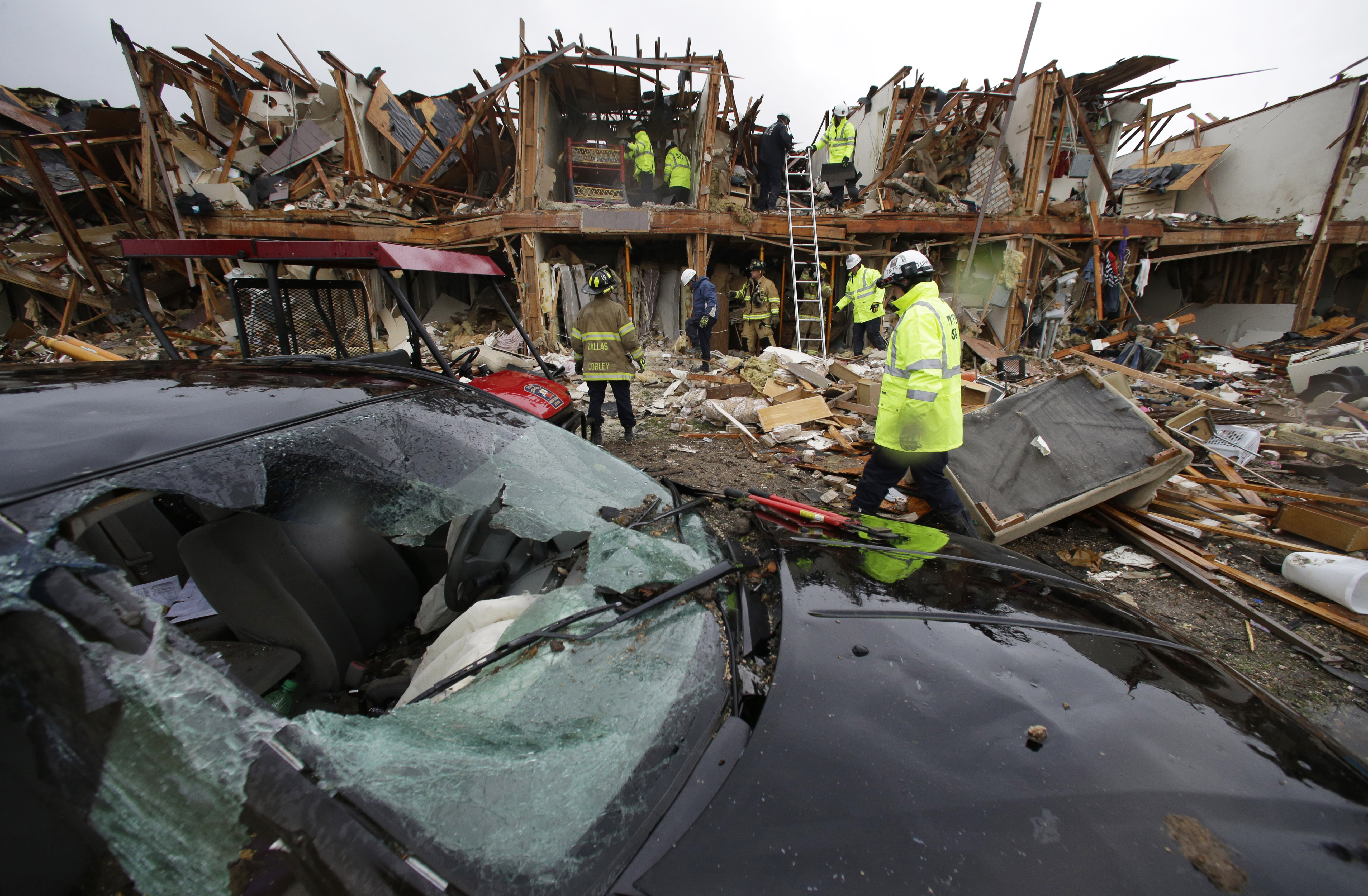 A smashed car sits in front of an apartment complex destroyed by an explosion at a fertilizer plant in West, Texas. (AP /LM Otero)