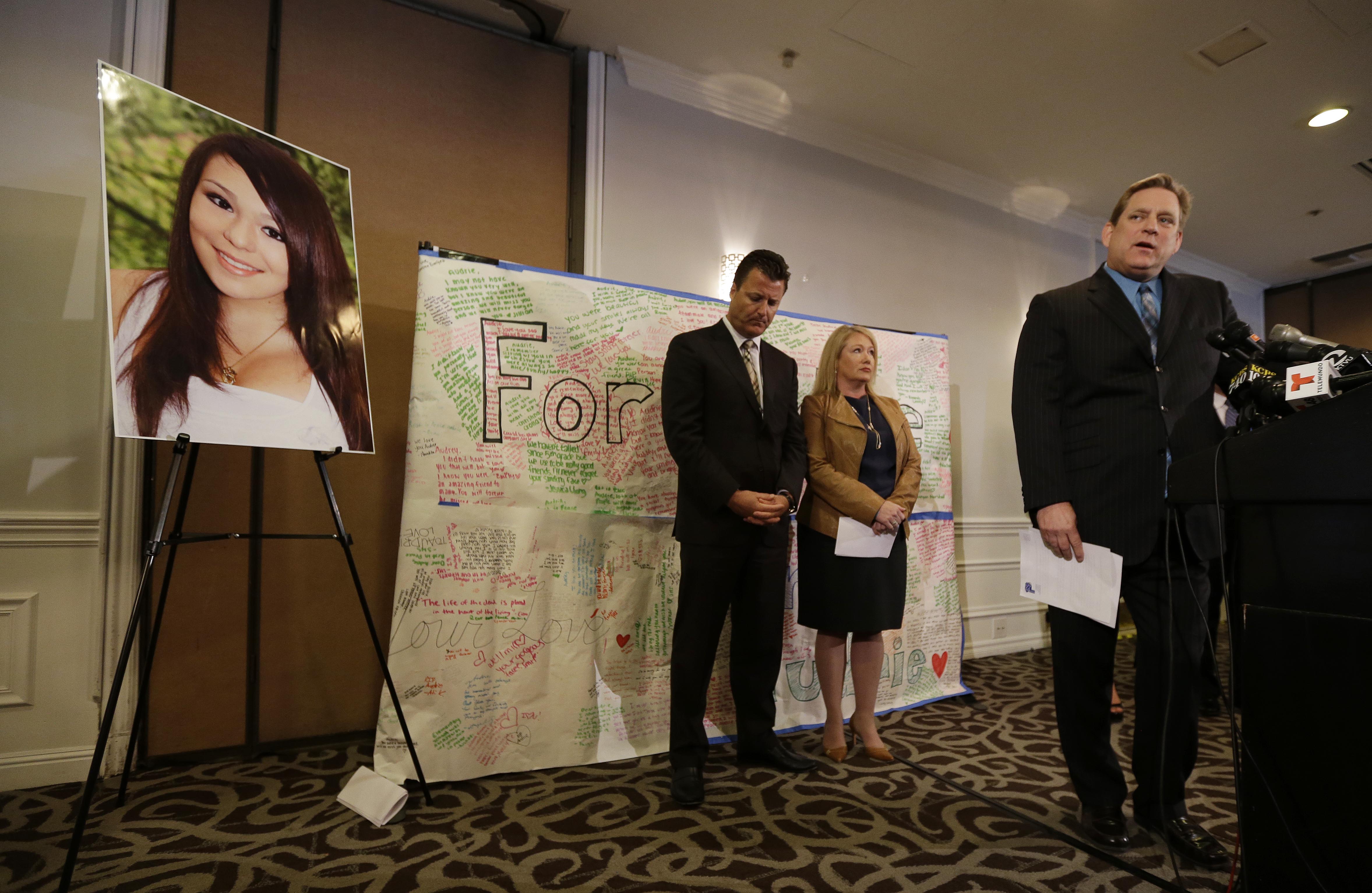 Larry Pott, right, father of Audrie Pott, who committed suicide after a sexual assault, answers questions as family representative Robert Allard, left, and Sheila Pott, mother of Audrie, listen during a news conference Monday. (AP/Eric Risberg)