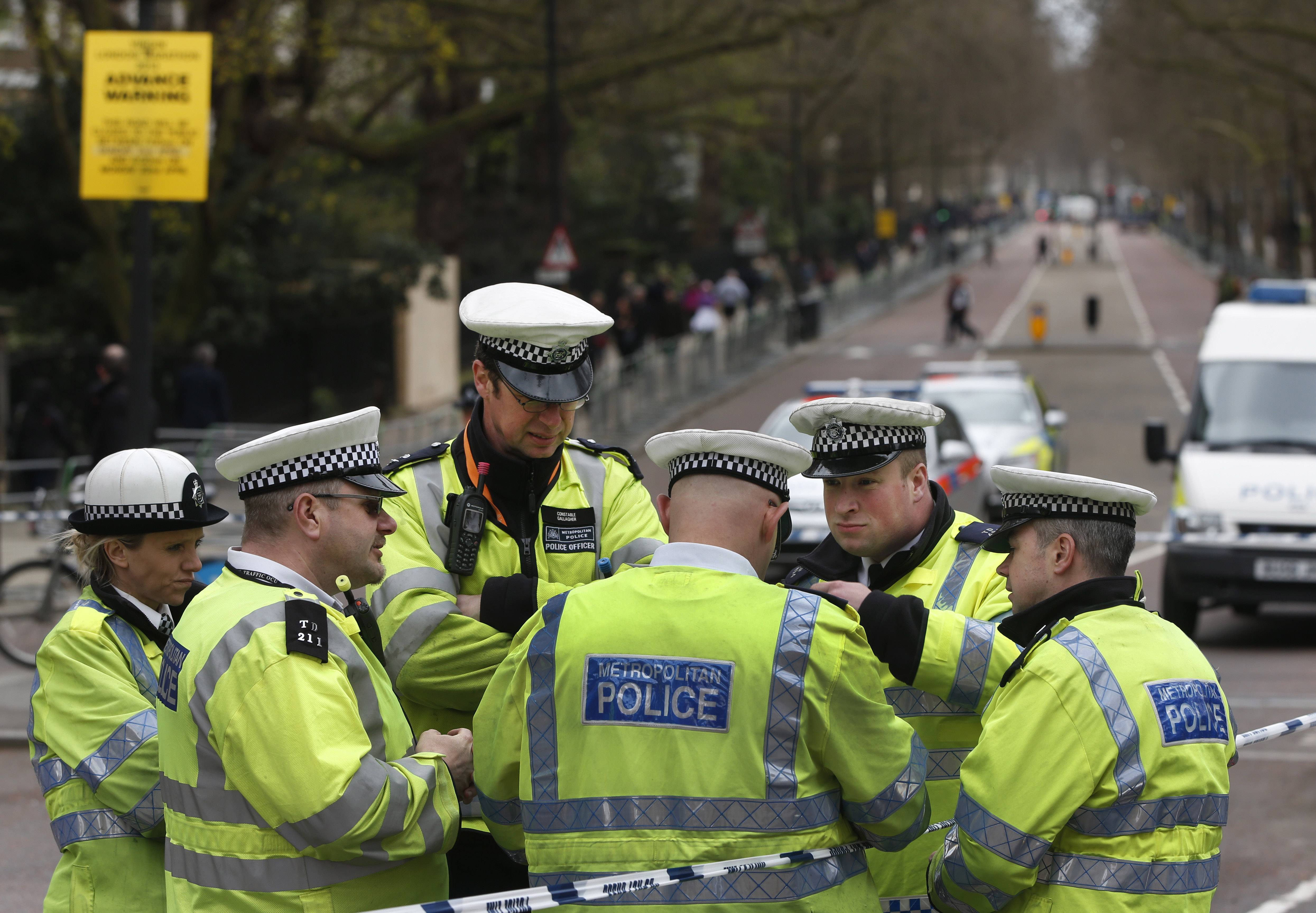 British police officers gather near the Mall in central London, Friday, April 19, 2013, where the London Marathon finish line will be on Sunday, April, 21, 2013. (AP/Lefteris Pitarakis)