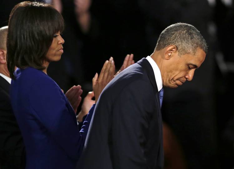 President Barack Obama, accompanied by first lady Michelle Obama in Boston, Thursday, April 18, 2013. (AP/Charles Krupa)