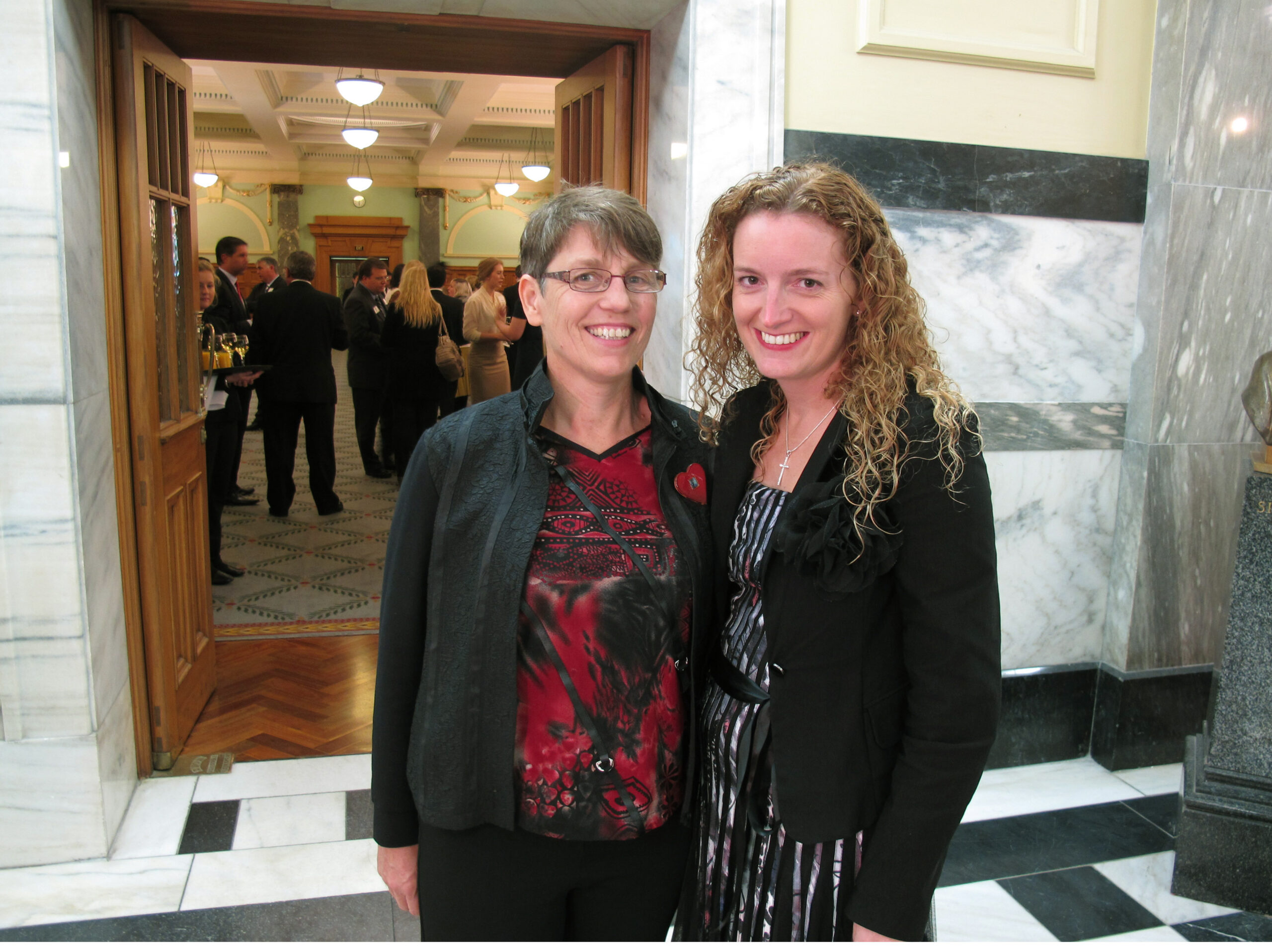 Jills Angus Burney (left) and Deborah Hambly arrive at New Zealand's Parliament in Wellington to watch lawmakers vote on gay marriage on Wednesday, April 17, 2013. (AP/Nick Perry)