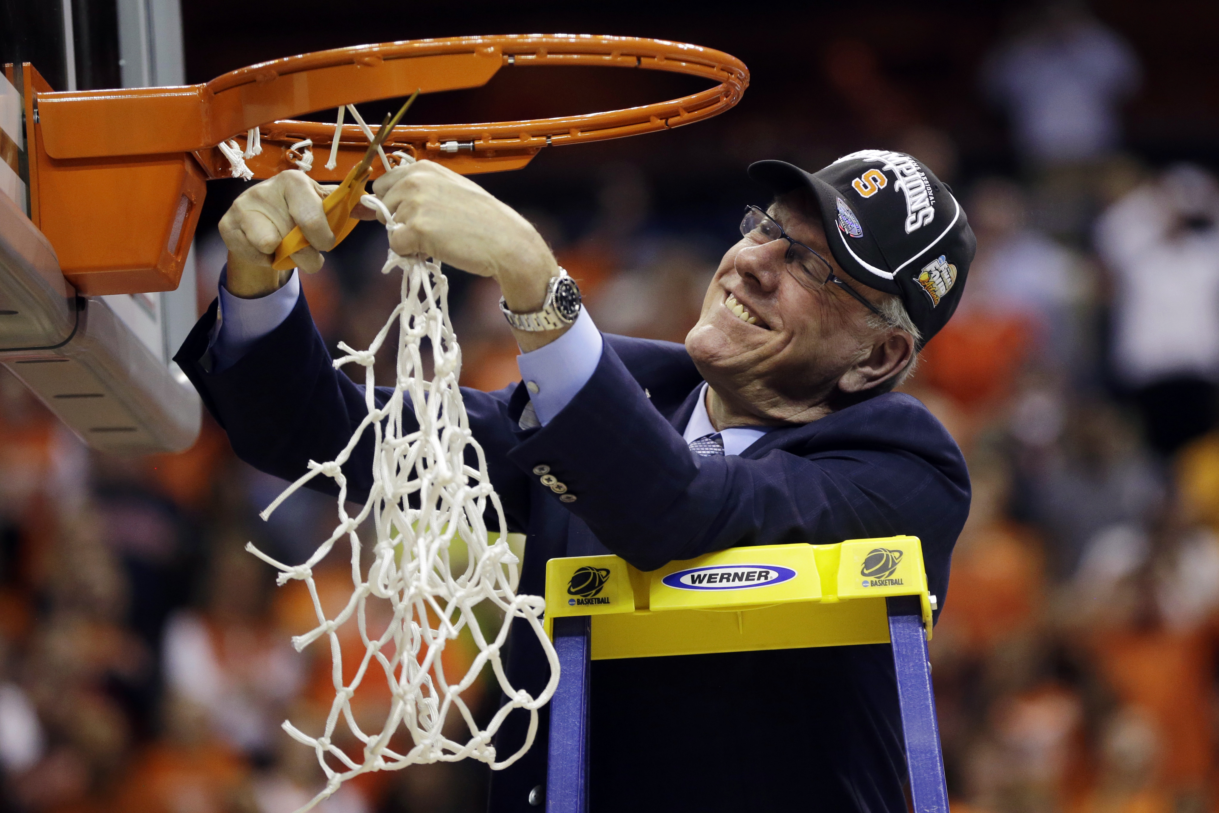 Syracuse head coach Jim Boeheim cuts down the net following their 55-39 win over Marquette in the East Regional final in the NCAA men's college basketball tournamen. (AP/Pablo Martinez Monsivais)
