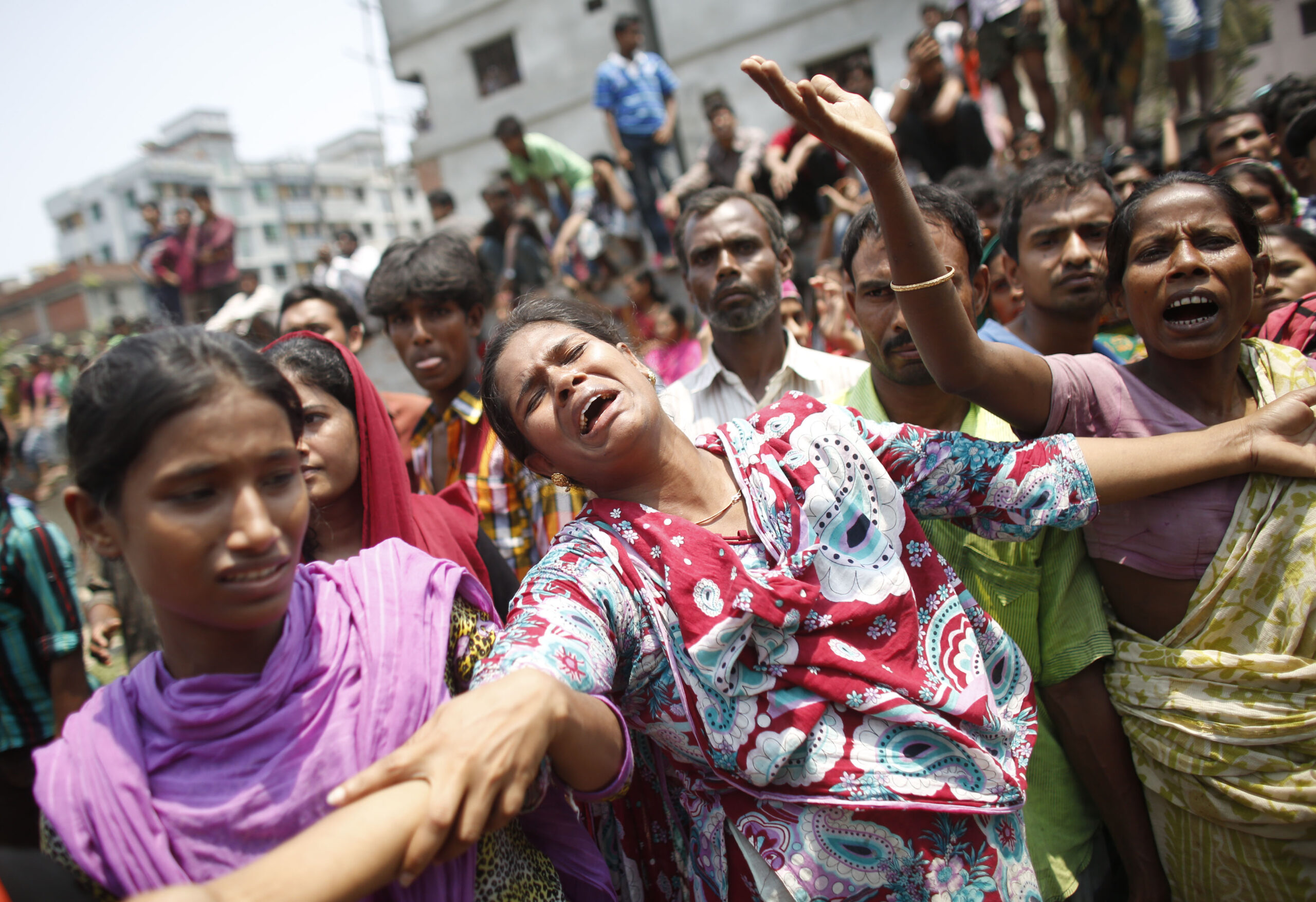 People mourn for their relatives, who were working in the Rana Plaza building when it collapsed, in Savar, 30 km (19 miles) outside Dhaka April 24, 2013. (Reuters/Andrew Biraj)
