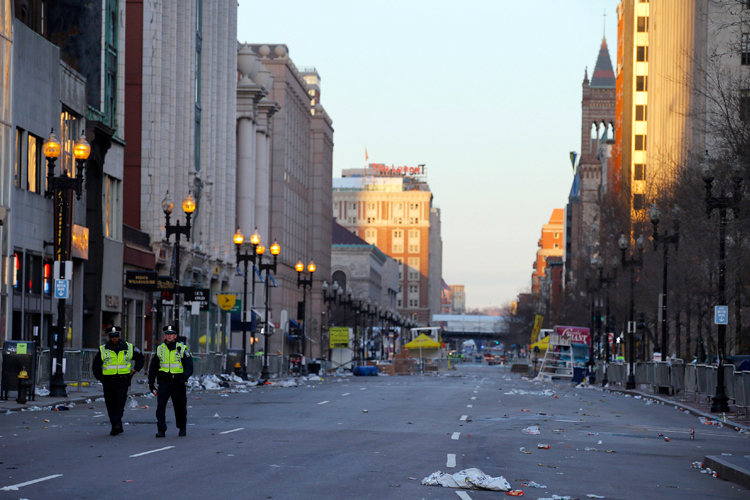Two police officers walk down Boylston Street, away from the finish line of the Boston Marathon in Boston, Massachusetts April 16, 2013. (Brian Snyder / Reuters)