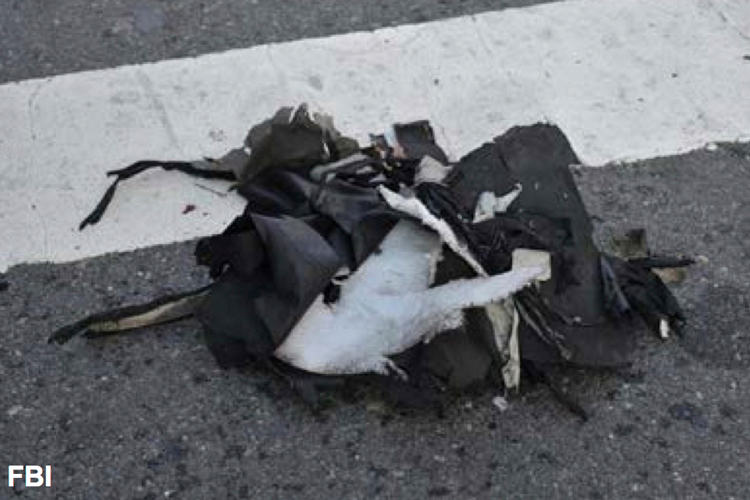This image from a Federal Bureau of Investigation and Department of Homeland Security joint bulletin issued to law enforcement and obtained by The Associated Press, shows the remains of a black backpack that the FBI says contained one of the bombs that exploded during the Boston Marathon. (AP/FBI)