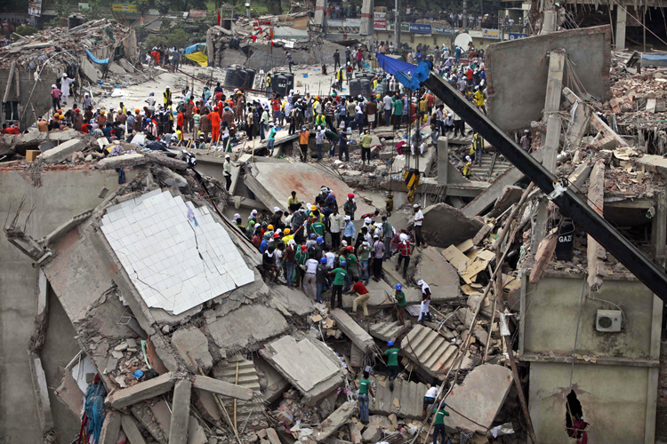 Bangladeshi rescuers work at the site of a building that collapsed Wednesday in Savar, near Dhaka, Bangladesh, Thursday, April 25, 2013. (AP/A.M. Ahad)
