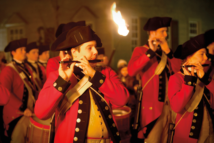Fife and drum corps march in Illumination of the Taverns in Colonial Williamsburg. (<a href='http://www.shutterstock.com/gallery-138433p1.html'>Steve Heap</a> via <a href='http://www.shutterstock.com/'>Shutterstock</a>)