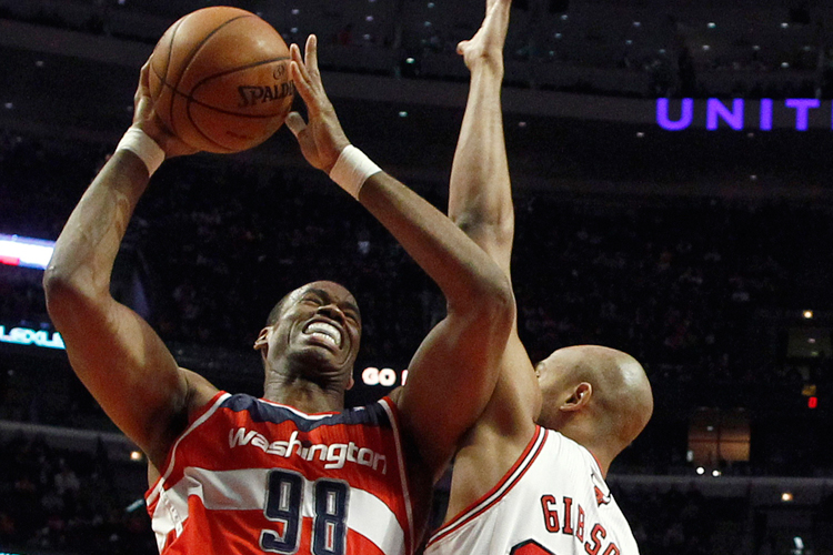 Jason Collins fights to the basket against Chicago Bulls' Taj Gibson, April 17, 2013. (Reuters/Jim Young)