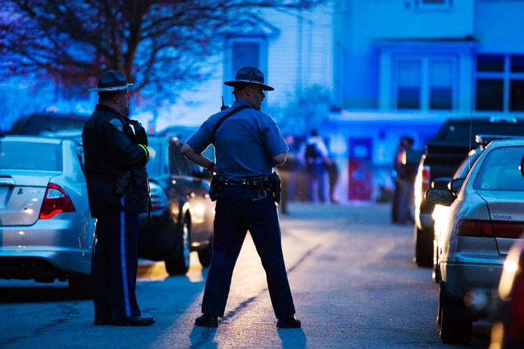 Law enforcement officials stand at the scene on Franklin St. as the search for Dzhokhar Tsarnaev, the surviving suspect in the Boston Marathon bombings, comes to an end in Watertown, Massachusetts April 19, 2013. (Reuters/Lucas Jackson)