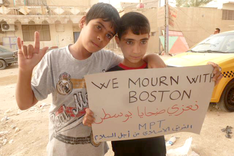 A photograph that went viral in the days following the Boston Marathon bombing, reportedly taken by MPT (Muslim Peacemaker Teams) of two boys in Iraq. (Facebook/America Loves Iraq)