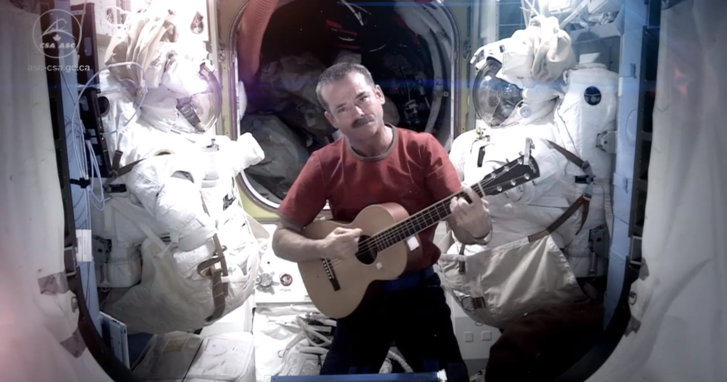 This image provided by NASA shows astronaut Chris Hadfield recording the first music video from space Sunday May 12, 2013. The song was his cover version of David Bowie's Space Oddity. Hadfield and astronaut Thomas Marshburn are scheduled to return to earth Monday May 13, 2013. (AP Photo/NASA, Chris Hadfield) (Associated Press)
