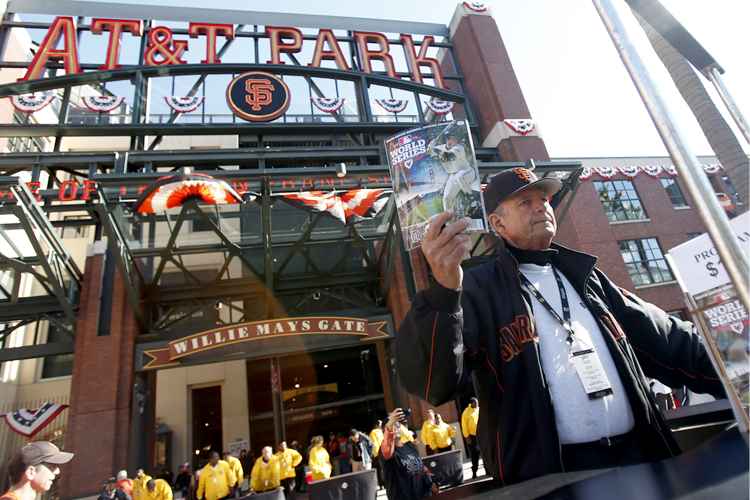 A vendor offers programs outside AT&T stadium. (Reuters/Stephen Lam)