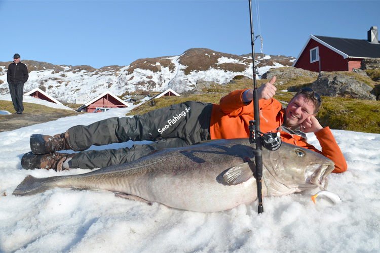 Michael Eisele, a 44-year-old who runs a fishing tackle firm in Kiel, Germany, gets chummy with his trophy catch. (Reuters/Norsk Telegrambyra As)