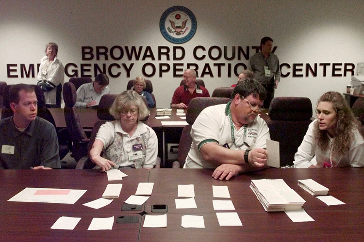 Counters and observers continue a hand recount of Broward County ballots, Nov. 19, 2000 (AP/Amy E. Conn)