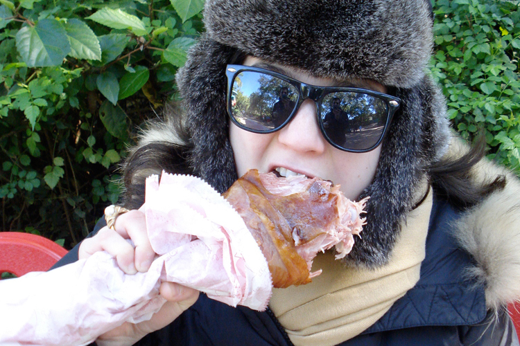 The author daintily nibbles on a turkey leg