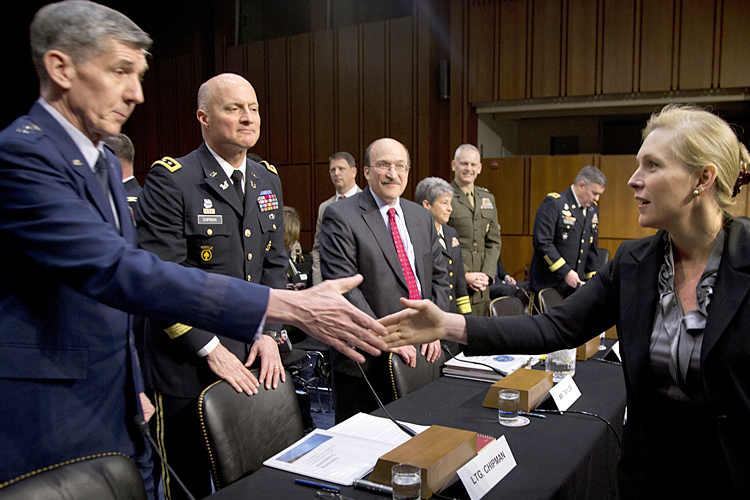 Sen. Kirsten Gillibrand shakes hands with Lt. Gen. Richard Harding, judge advocate general of the Air Force, March 13, 2013. (AP/Carolyn Kaster)