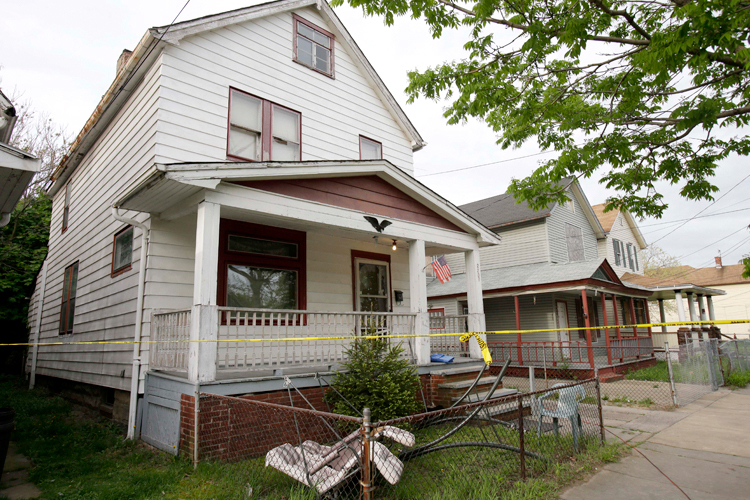 The Cleveland house where Amanda Berry, Gina DeJesus and Michelle Knight were allegedly kept in captivity for nearly a decade. (AP/Tony Dejak)