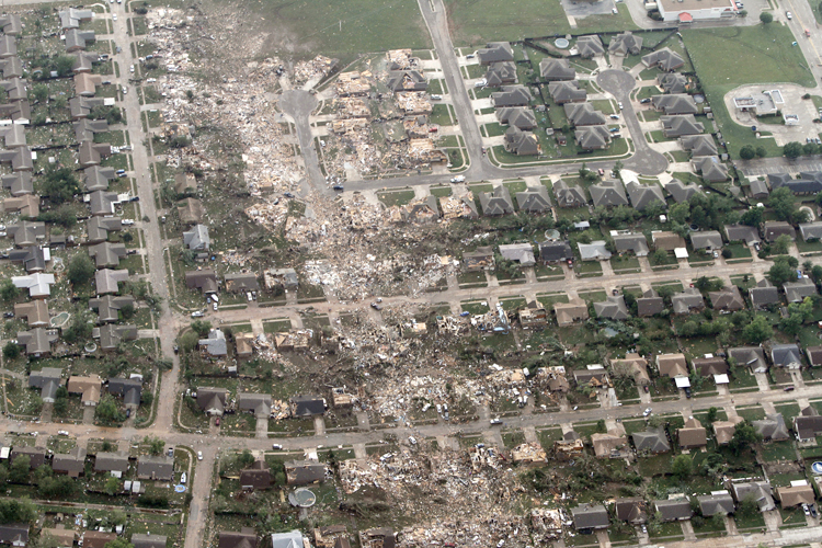 The remains of homes hit by a massive tornado in Moore, Okla., Monday May 20, 2013. (AP/Steve Gooch)