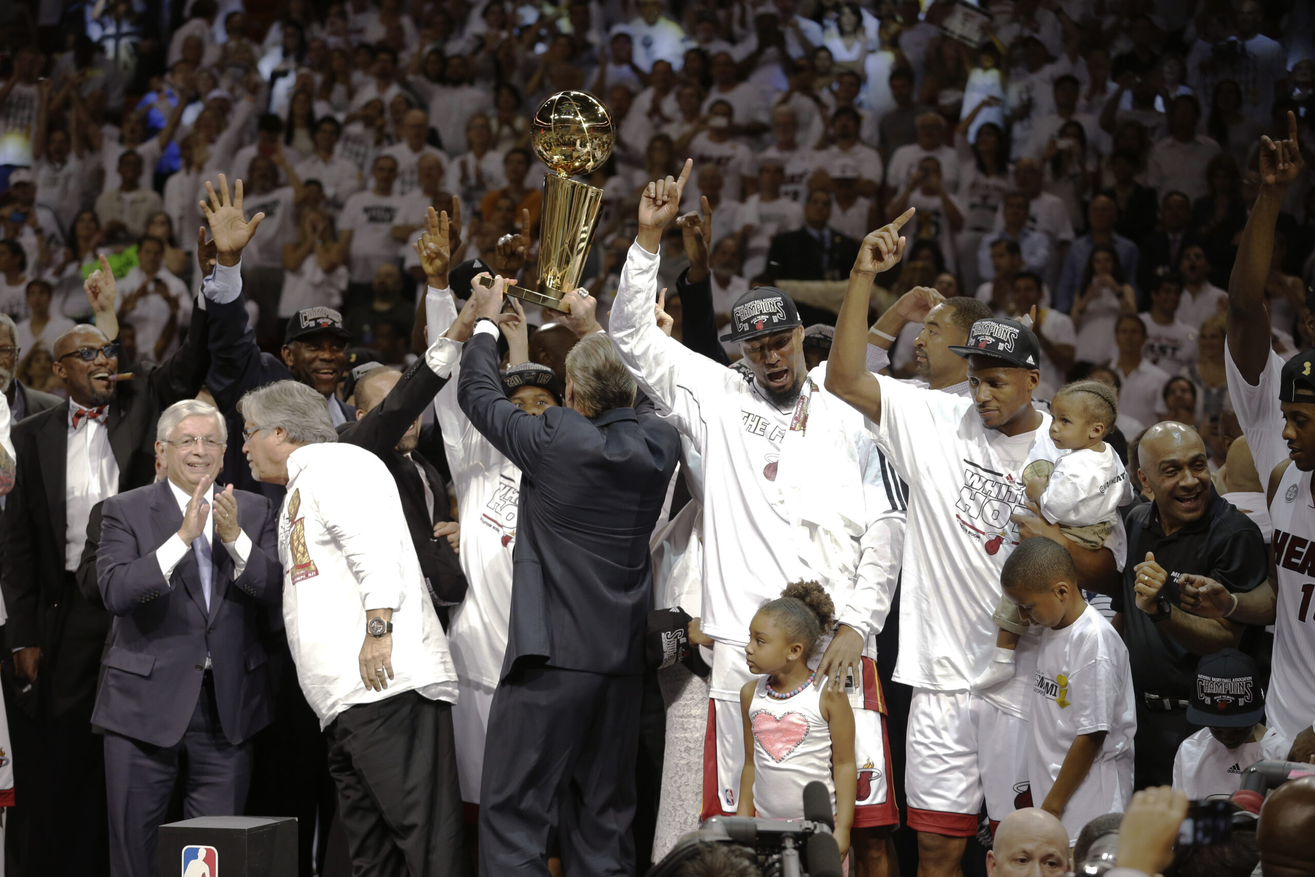 The Miami Heat celebrate after defeating the San Antonio Spurs 95-88 to win their second straight NBA championship. (AP/Lynne Sladky)