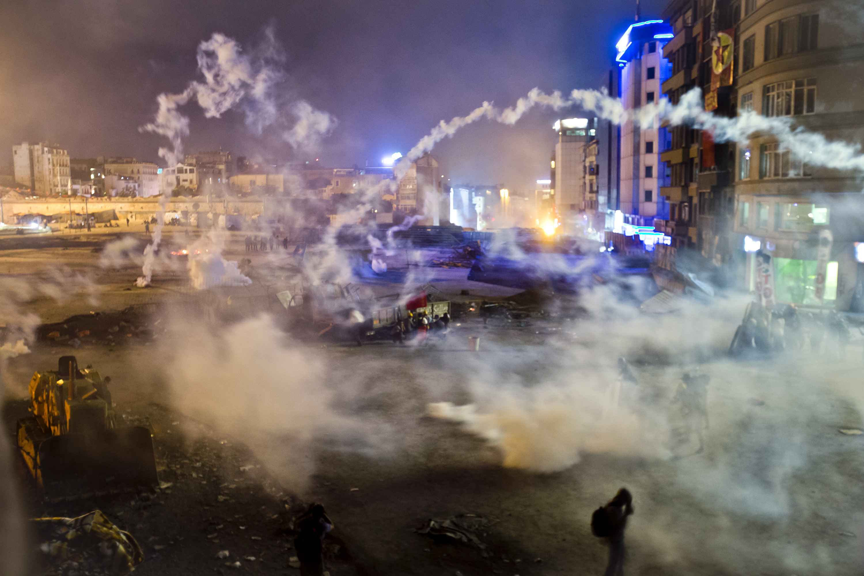 Taksim Square is flooded by tear gas as clashes between protesters and riot police continue into the night in Istanbul Tuesday, June 11, 2013. (AP/Vadim Ghirda)