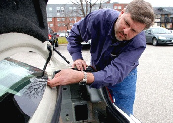 University of Windsor engineering professor Colin Novak works on a prototype for turning a car’s rear window into a stereo speaker. This summer he’ll be turning his acoustics experience to an investigation of the Windsor hum. (UWin Daily News)