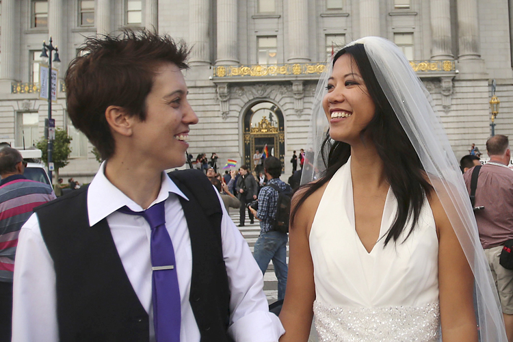 Lisa Dazols and Jenny Chang celebrate outside the city hall in San Francisco, California, June 26, 2013. (Reuters/Jed Jacobsohn)