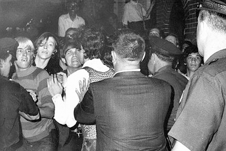 Police force people back outside the Stonewall Inn as tensions escalate the morning of June 28, 1969. (Wikimedia/Joseph Ambrosini)