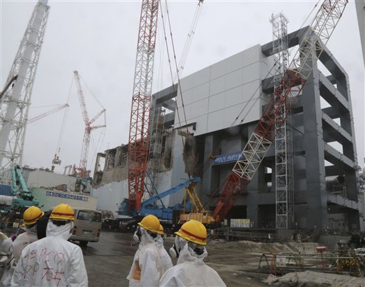The steel structure for the use of the spent fuel removal from the cooling pool is seen at the Unit 4 of the Fukushima Dai-ichi nuclear plant at Okuma in Fukushima prefecture, Japan, Wednesday, June 12, 2013. (AP Photo/Noboru Hashimto)
