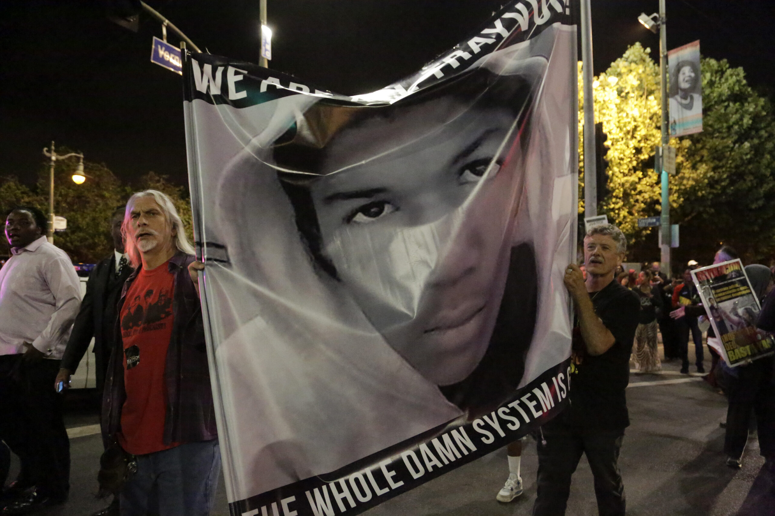 Protesters hold an image of Trayvon Martin while marching in the Leimert Park area of Los Angeles, California, following the George Zimmerman verdict (Reuters/Jason Redmond)