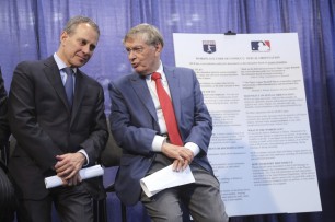 AG Eric Schneiderman, left, with MLB Commissioner Bud Selig on Tuesday (Mary Altaffer/Associated Press)