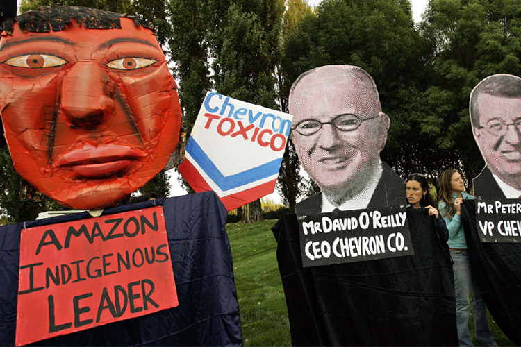 Members of Amazon Watch and Amnesty International picket in front of Chevron Corp. world headquarters in San Ramon, Calif. (AP/Ben Margot)