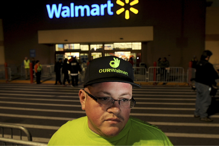Protester outside a Walmart store (Reuters/Noah Berger)