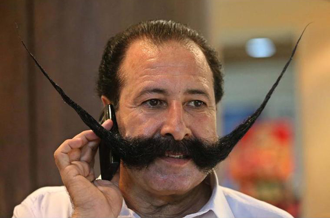 "I can leave my family, I can leave Pakistan, but I can never cut my mustache again," said Afridi [EPA]