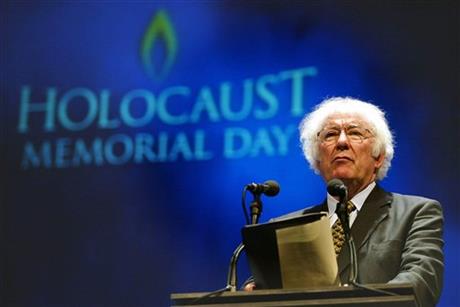 FILE - A Tuesday, Jan. 27, 2004 photo from files showing former Nobel Prize winning poet Seamus Heaney speaking during a rehearsal for the Northern Irish national Holocaust commemoration at the Waterfront Hall, Belfast, Northern Ireland. (AP Photo/Peter Morrison, File)