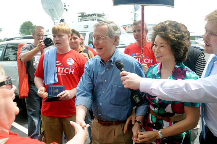 U.S. Sen. Mitch McConnell, R-KY, greets supporters during the 133rd Annual Fancy Farm Picnic in Fancy Farm, Ky., Saturday, Aug. 3, 2013. (AP/Stephen Lance Dennee)