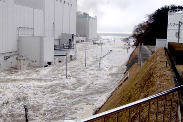 Fukushima Dai-ichi nuclear power plant is flooded as a tsunami strikes (AP/Anonymous)