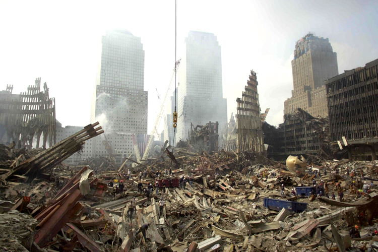Rescue workers sift through debris at the scene of what was once the
plaza area of the World Trade Center twin towers, Sept. 24, 2001. (Reuters)