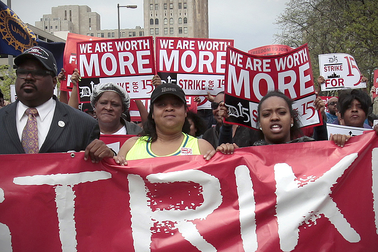 Workers and labor activists march for a higher minimum wage for fast food workers in Detroit, May 2013. (Reuters/Rebecca Cook)