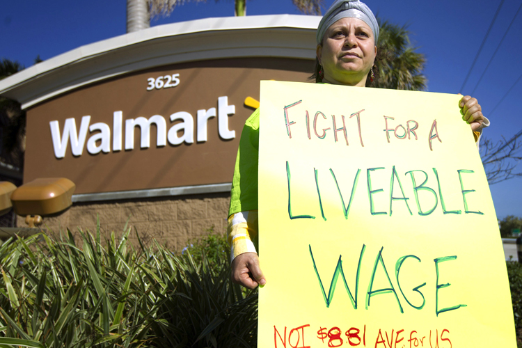 Employee protesting in front of Walmart (AP/J Pat Carter)